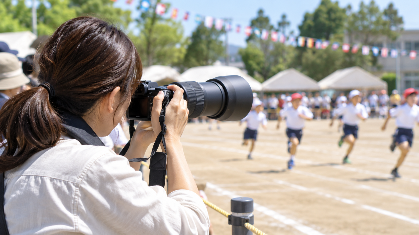 α6400と望遠レンズで運動会を撮影するイメージ