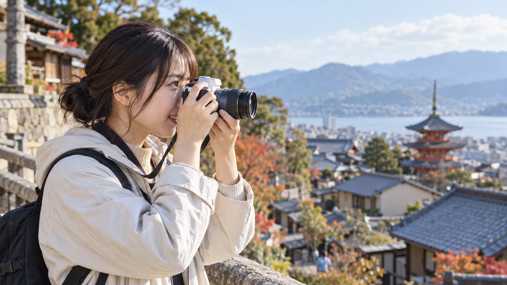 EOS Kiss Mと高倍率ズームレンズで旅行先の風景を撮影する女性